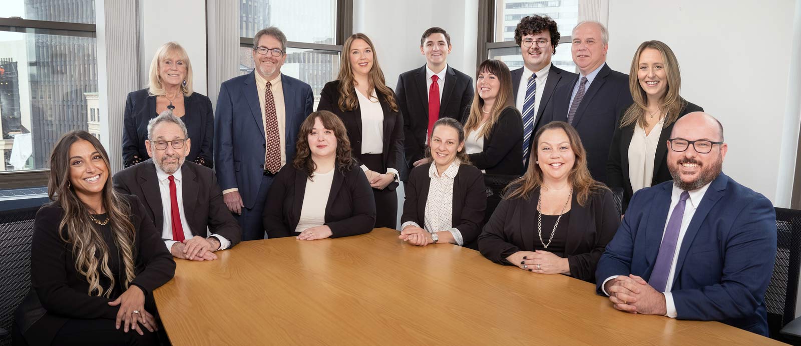 A photograph of the staff of Sandulli Grace ,PC